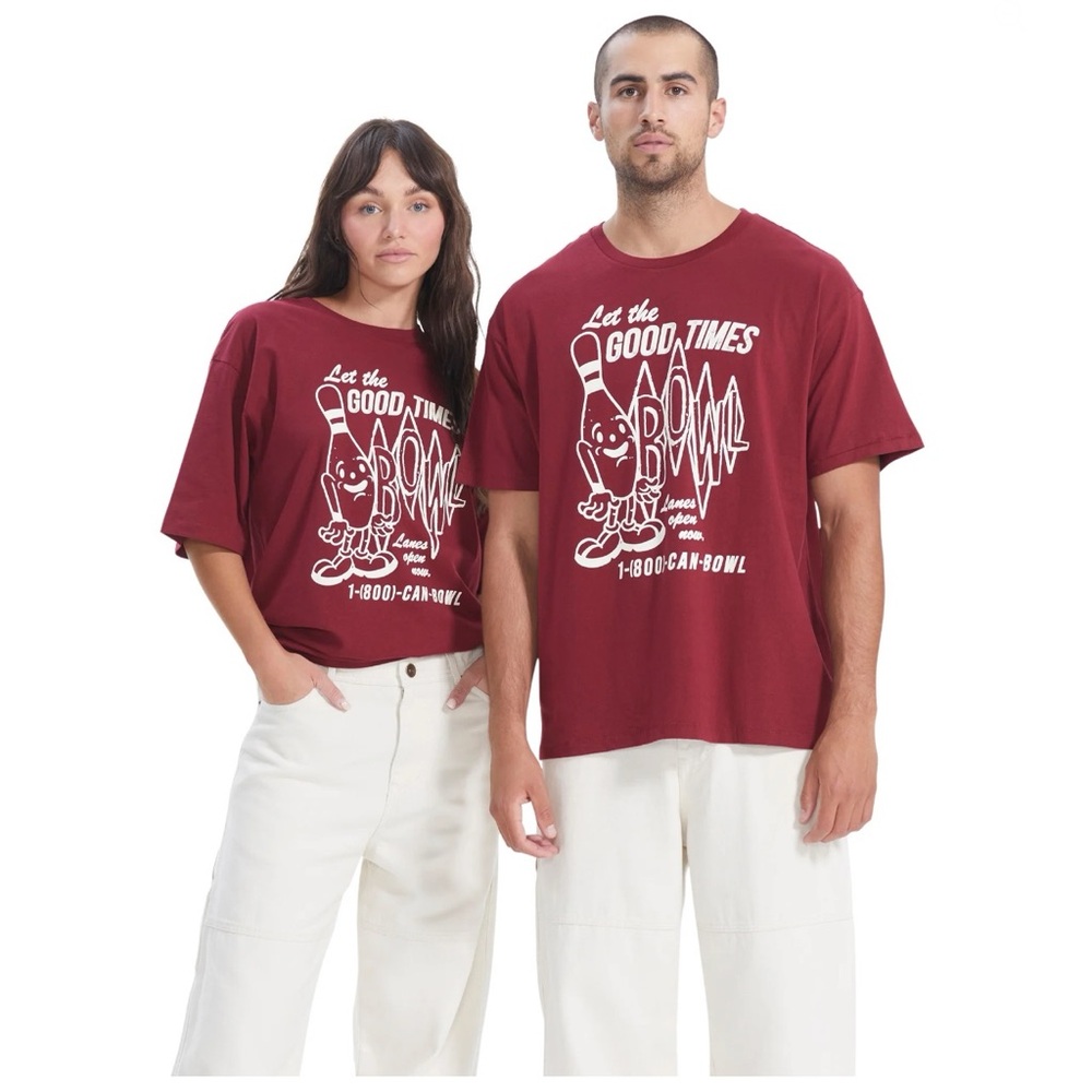 Unisex Oversized Graphic Tee, Sizes XS. Color: red burgundy.